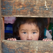 Little girl at Ura village festival near Bumthang, Bhutan