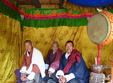 Village elders watch festivities at Ura Yakchoe (village festival) near Bumthang, Bhutan
