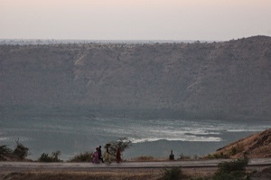 Women returning home from work at sundown, Lonar